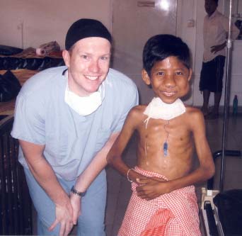 Carl and Cambodian boy with facial tumour